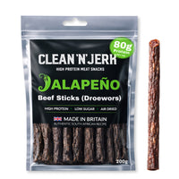Jalapeño Droewors beef sticks pouch with one meat stick beside it